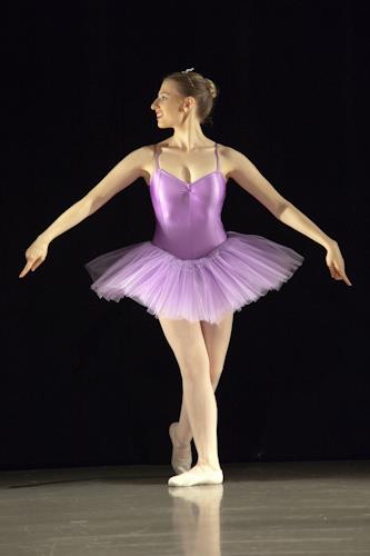 Helen Snowden in purple leotard and tutu, holding an iconic pose from Sleeping Beauty.